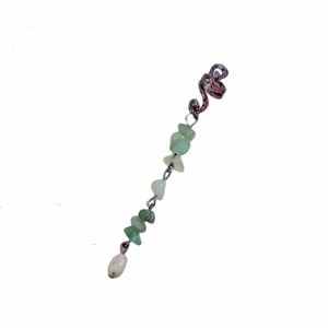 Detail of colorful alloy coil hair jewelry featuring natural green stone pendants