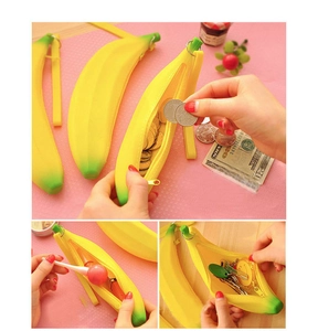 Macro detail of realistic banana silicone coin purse showing capacity for coins and keys