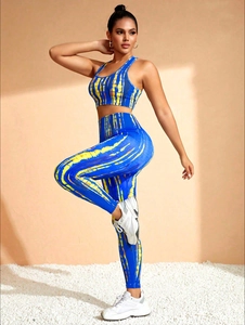 Detail of royal blue and yellow tie-dye seamless yoga set with high-waist leggings