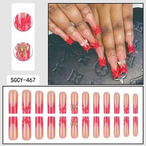 3D French butterfly press-on nails with red-orange gradient flame design in coffin shape