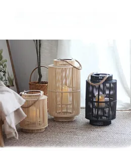 Detailed view of woven bamboo lanterns with rope handles and battery candles