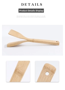 Detail of natural bamboo salad tongs showing wood grain texture and hanging hole design