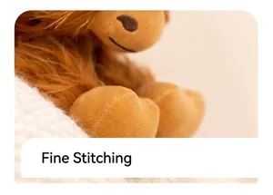 Macro detail of high-quality stitching and brown plush texture on the highland cow toy