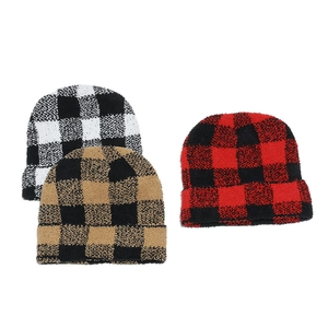Detail showing the plush buffalo plaid texture of knitted beanies in three classic colors