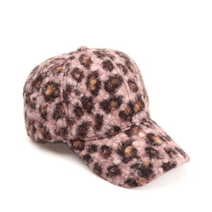 Close-up of leopard print baseball cap featuring warm faux shearling and textured fabric