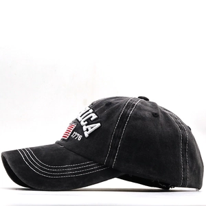 Detail of AMERICA 1776 embroidery and US flag patch on washed cotton baseball cap