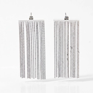 Macro shot of silver-colored S-shaped stainless steel chain fringe tassel earrings