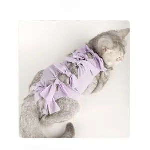 Detail view of purple pet recovery suit with stripe texture and bowknot decorations