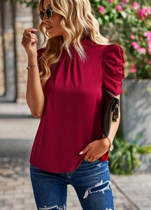 Fashion detail of wine red puff sleeve blouse with stand collar and satin texture