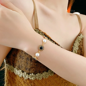 Vintage floral pearl bracelet with black crystals on a gold setting for women