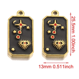 Macro view of rectangular tarot pendants with celestial stars and moon enamel details