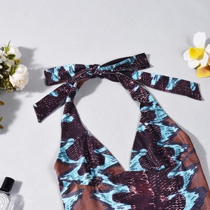 Detail of snake print halter top with large bow tie and blue animal pattern details
