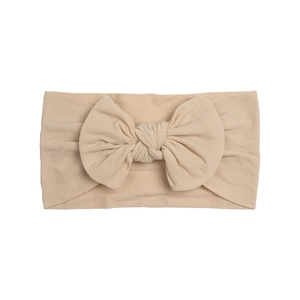 Soft nylon beige bow headband for babies and toddlers with elastic knitted fabric