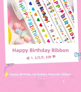Detail of white polyester birthday ribbons with colorful lettering and cartoon patterns