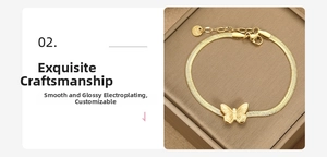 Detail of a gold butterfly pendant and snake chain bracelet with adjustable lobster clasp
