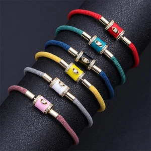 Detail of colorful Evil Eye charm bracelets with micro-pave crystals on adjustable cord