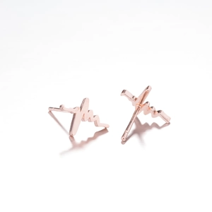 Modern rose gold heartbeat pulse earrings made of stainless steel on reflective background