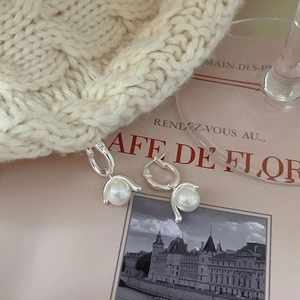 Elegant 925 sterling silver pearl drop earrings on a romantic French style background