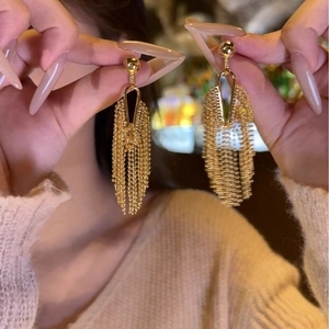 Elegant gold-tone metal tassel earrings featuring a sleek minimalist drop design for women