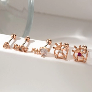 Set of 5 rose gold cartilage earrings with heart, fishbone, and crown zircon designs