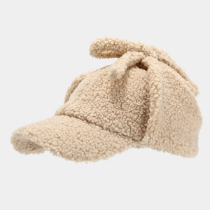Beige Sherpa fleece trapper baseball hat with earflaps and a top bow for winter warmth