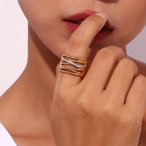 18K gold plated multi-layer crisscross ring with rhinestones shown on model finger