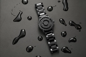 Detail of waterproof matte black skull watch dial with magnetic beads and zodiac symbols