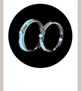 Detail of couple rings with blue luminous enamel and sparkling cubic zirconia stones