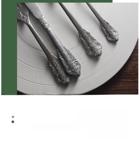 Close-up of vintage 304 stainless steel cutlery with intricate embossed floral handles