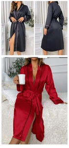 Detail view of long silk satin robes with contrast piping and side slits in red and black