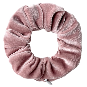 Close-up of pink velvet scrunchie featuring a functional hidden zipper storage pocket