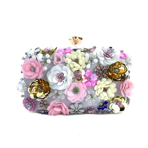 Close-up of handmade floral beadwork with sequins and silk on this elegant evening clutch bag