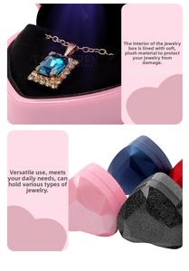 Detail of heart jewelry box featuring a built-in LED light and soft black plush interior