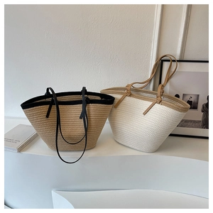 Detailed comparison of two woven tote bags in khaki and cream with faux leather straps