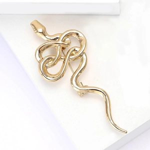 Minimalist gold snake brooch in polished alloy, vintage style accessory for coats