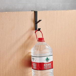 Portable black metal desk hook holding a 4kg water bottle to show strong load capacity