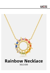 Detailed macro view of gold sunflower pendant with colorful rainbow zircons and fine chain