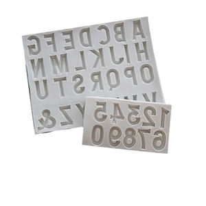 Grey silicone molds featuring uppercase letters A-Z and numbers 0-9 for cake decorating