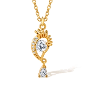 Close-up of 18K gold plated necklace with flower zircon and teardrop crystal detail