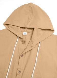 Detail of linen blend hooded shirt showing texture and size L label with drawstring cord