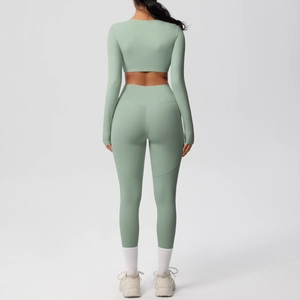 Sage green yoga set showing back view of long sleeve crop top and high waist leggings