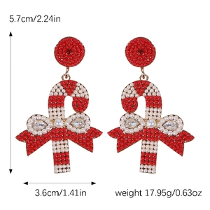 Detailed view of red and white candy cane earrings with bow and rhinestone dimensions