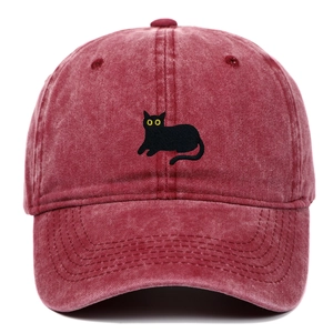 Close-up of black cat embroidery on vintage washed burgundy cotton baseball cap