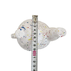 Top view of white speckled canister showing 11-12cm diameter measurement with tape