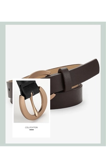 Close-up of dark brown leather belt with a round gold horseshoe buckle on a white background