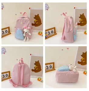 Detailed views of pink kids backpack with checkered pocket and plush rabbit charm