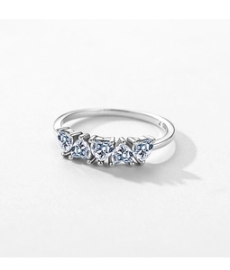 Macro shot of S925 sterling silver ring featuring five heart-cut cubic zirconia stones