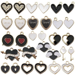 Assorted black and white heart charms with wings and Love engraving for DIY jewelry