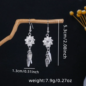 Detail view of ethnic flower earrings with leaf tassels showing 5.3cm length measurement