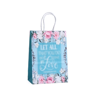 Floral kraft paper gift bag with blue rose print and sturdy twisted handles